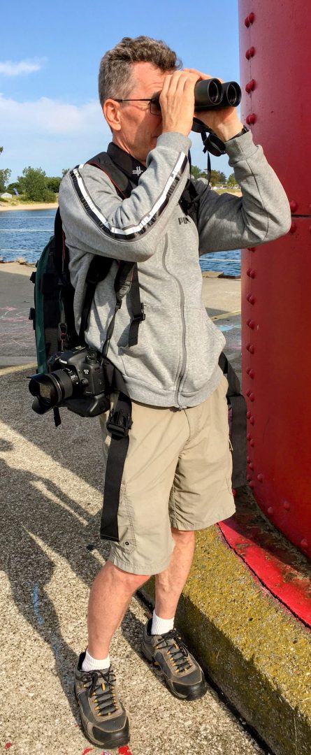 Matt with binoculars and camera at Muskegon Lighthouse, Michigan